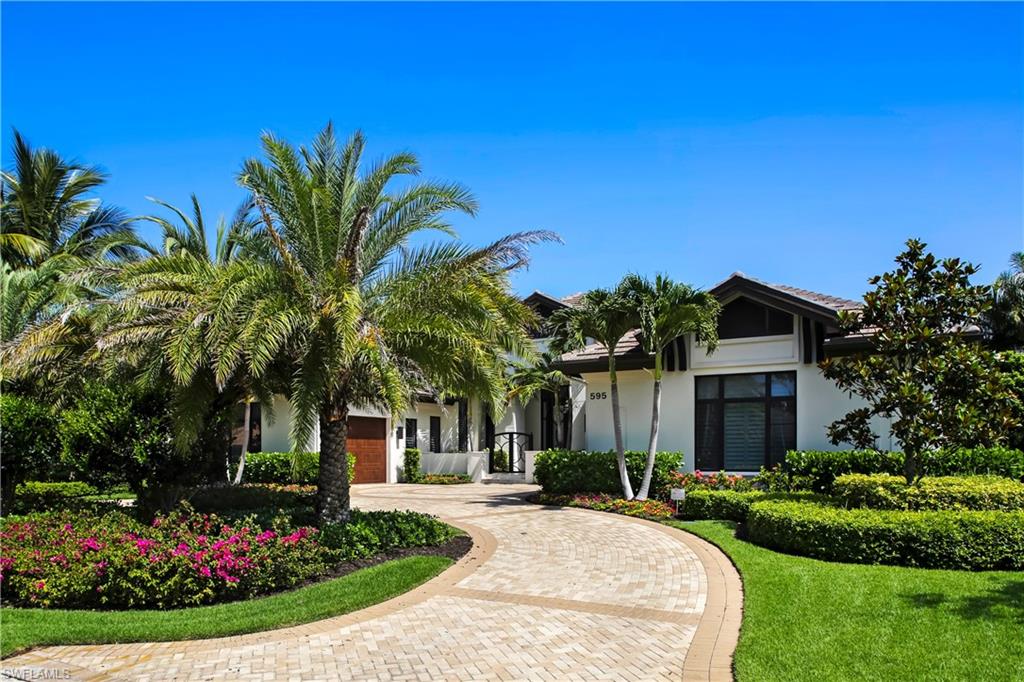 Contemporary exterior with white stucco finish and dark trim accents