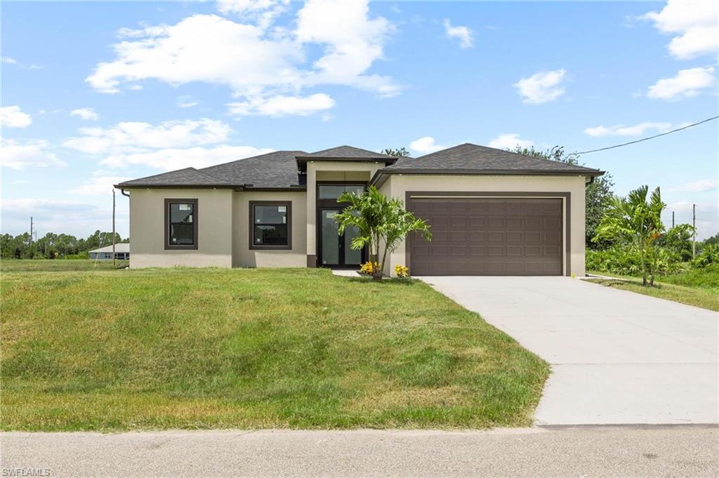 Contemporary stucco exterior with dark trim windows
