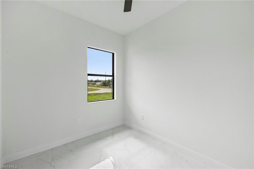 Bright interior space with white walls and baseboards