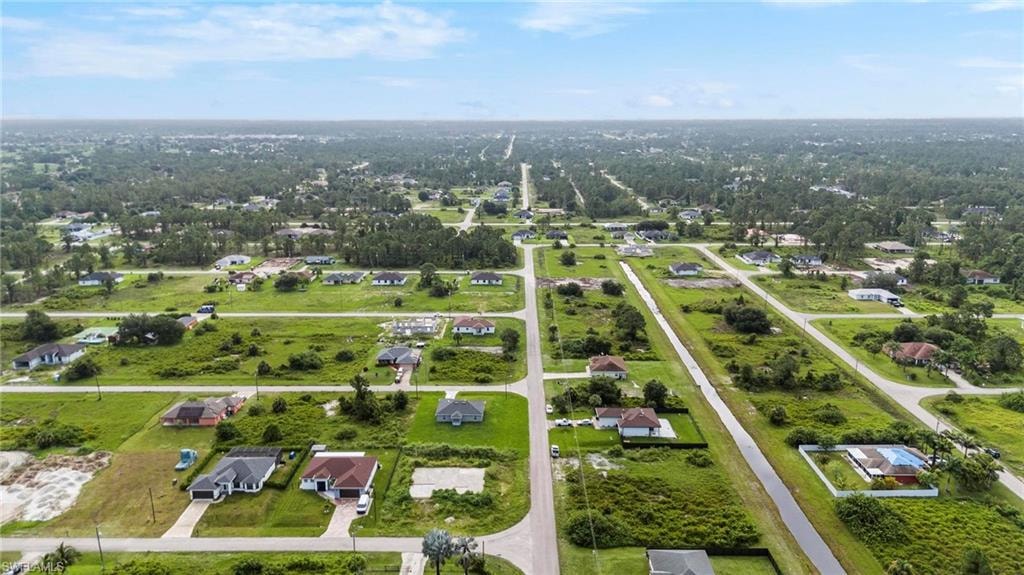 Expansive aerial perspective showcasing a residential area with single-family homes on spacious lots