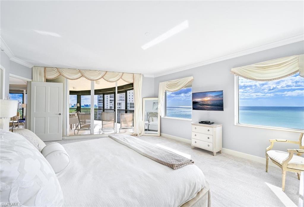 Expansive room with neutral carpeting and light-toned walls