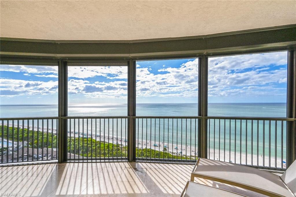 Expansive curved balcony featuring panoramic ocean and coastline scenery