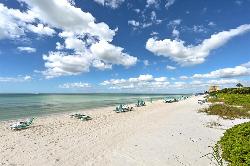 Expansive sandy beach with calm turquoise waters