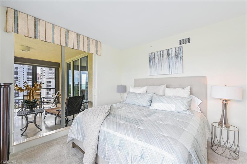 Bedroom featuring light-colored walls and carpet flooring