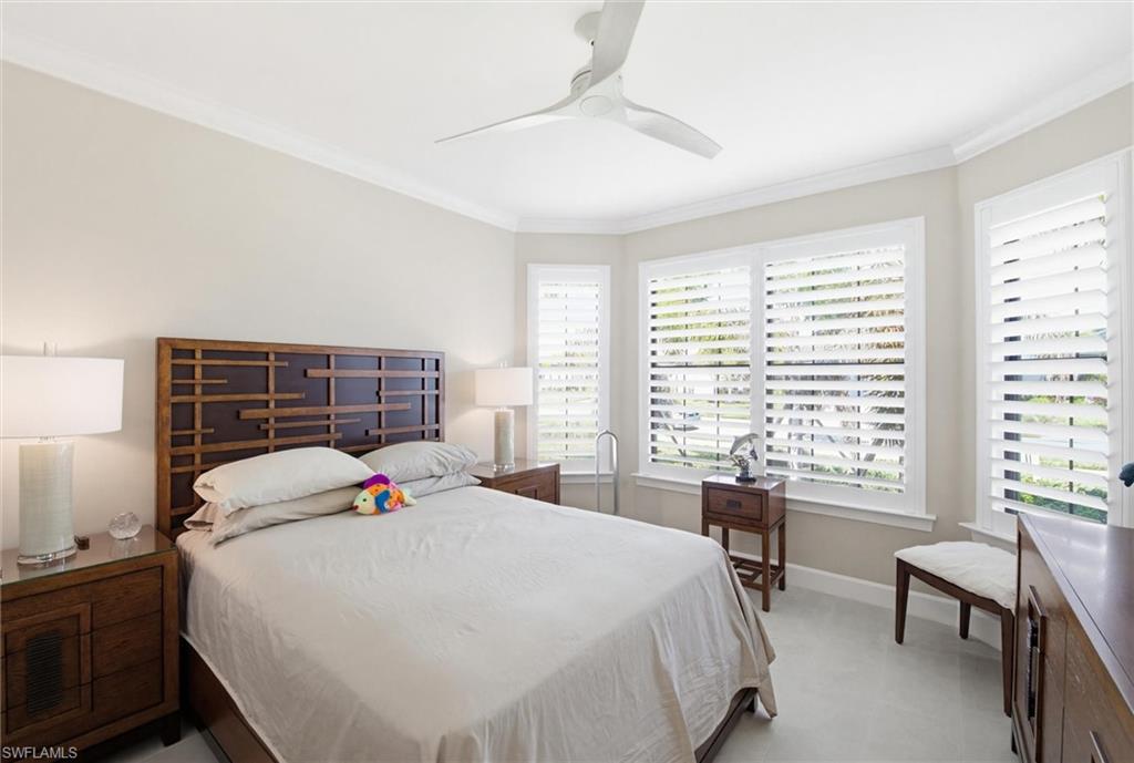 Bedroom featuring crown molding and ceiling fan