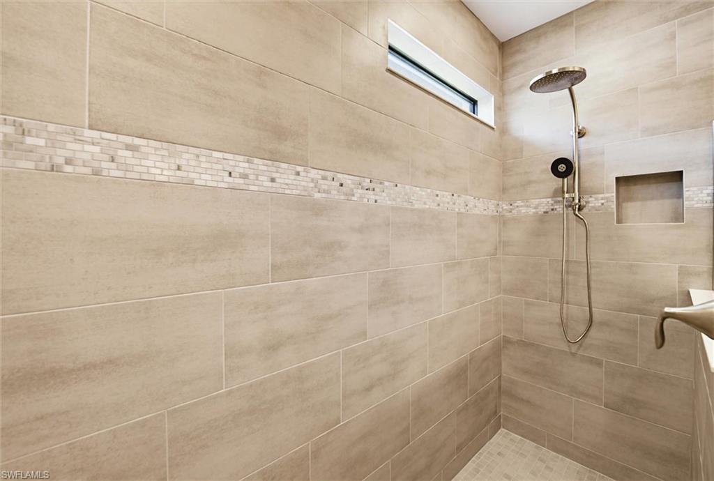 Full bath with a tile shower