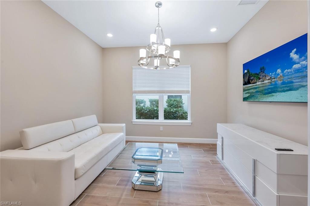 Bright interior space featuring wood-finish flooring and neutral wall tones
