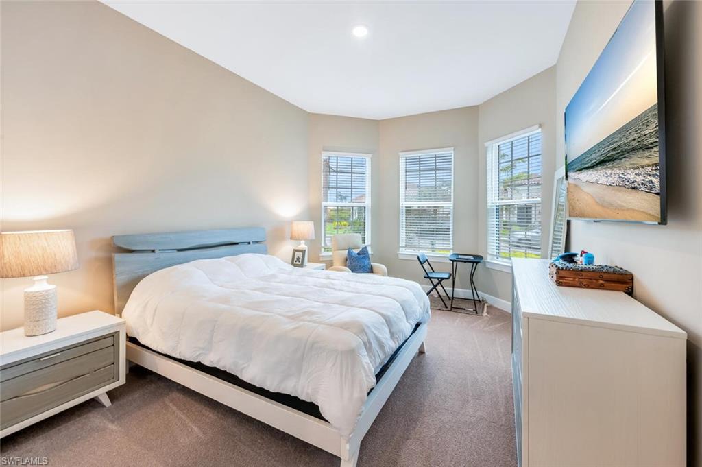 Neutral-toned walls and plush carpeting define this space
