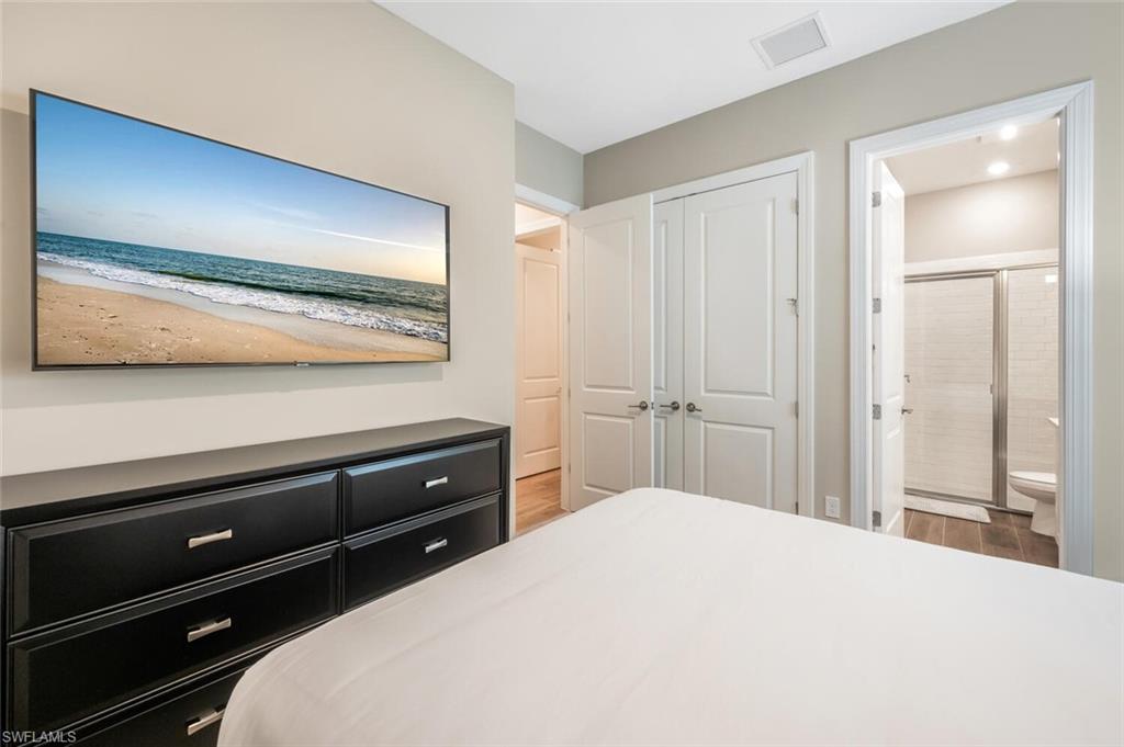 Bedroom featuring light neutral wall tones and white trim
