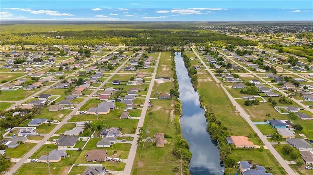 Aerial perspective showcasing a developed residential area with numerous single-family homes