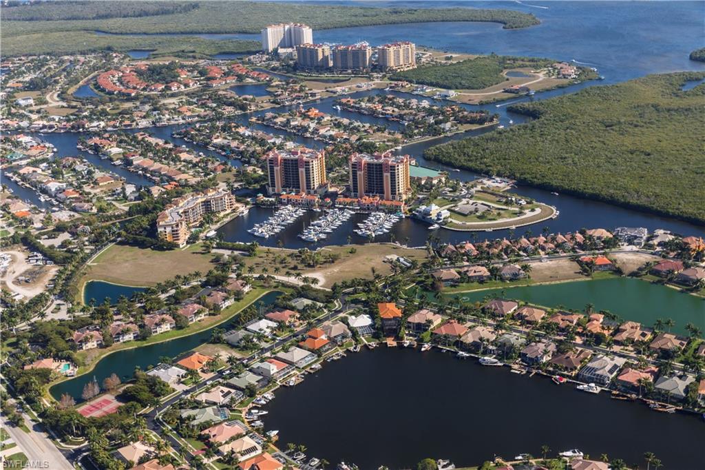 Aerial perspective showcasing a waterfront community with extensive canal systems and numerous private docks