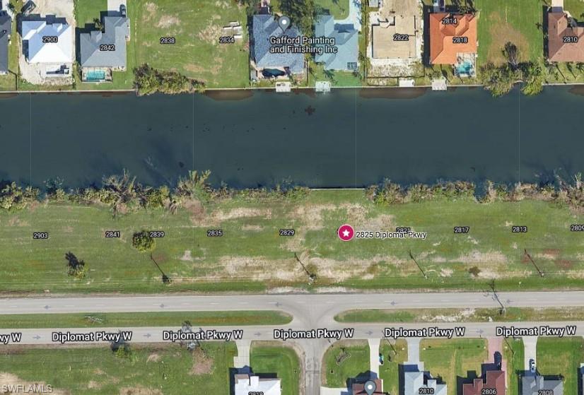 Aerial Map. Indicating the parcel at 2825 Diplomat Pkwy W in relation to surrounding properties and waterways