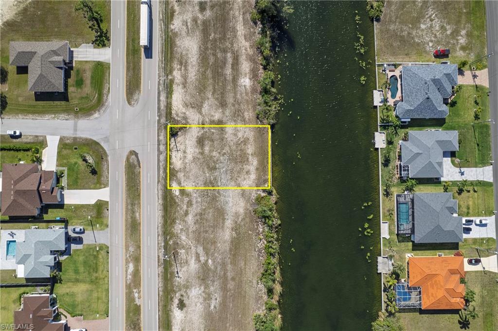 Cleared lot with water access, situated on a canal with direct access to a paved roadway