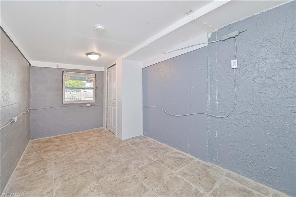 Empty room with concrete block wall