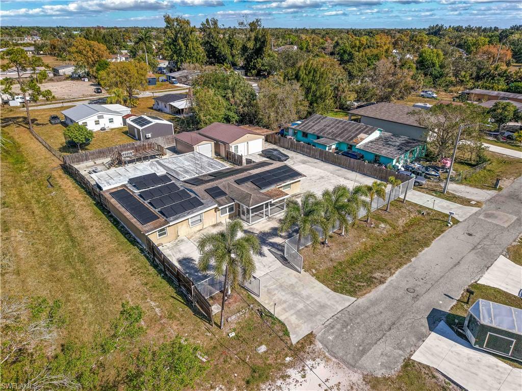Aerial view of property's location with nearby suburban area