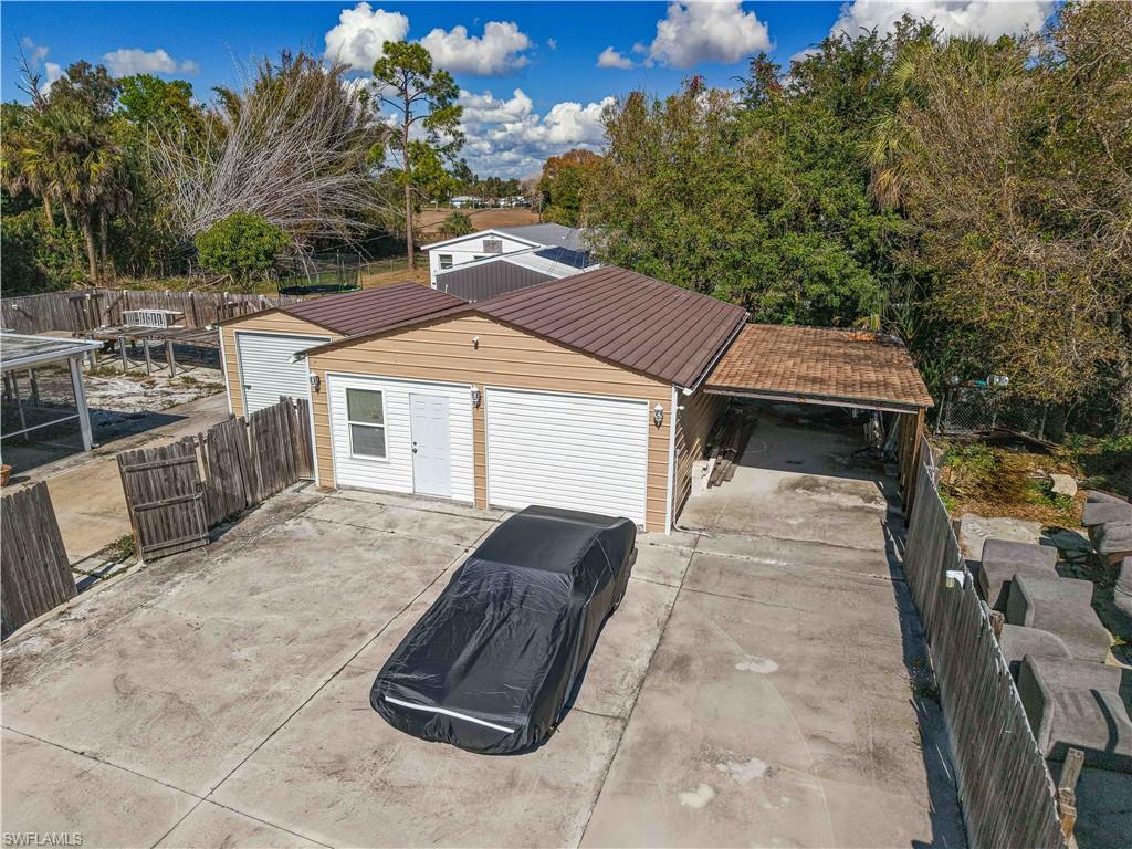 Garage featuring driveway