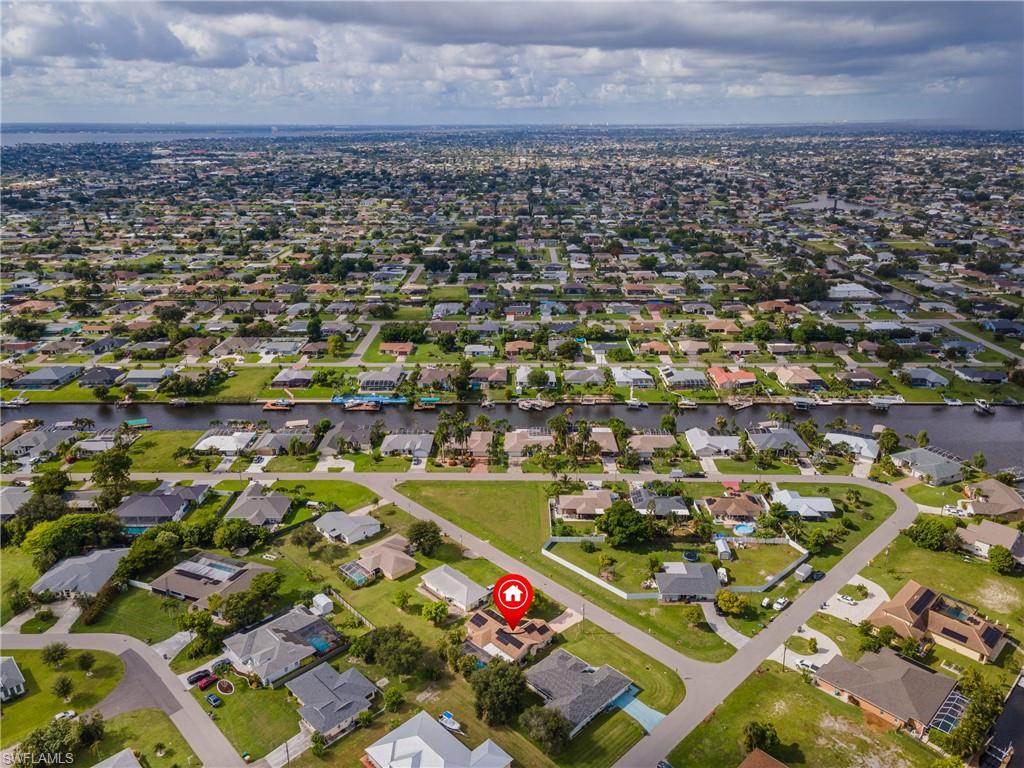 Aerial perspective showcasing a residential neighborhood with numerous single-story homes