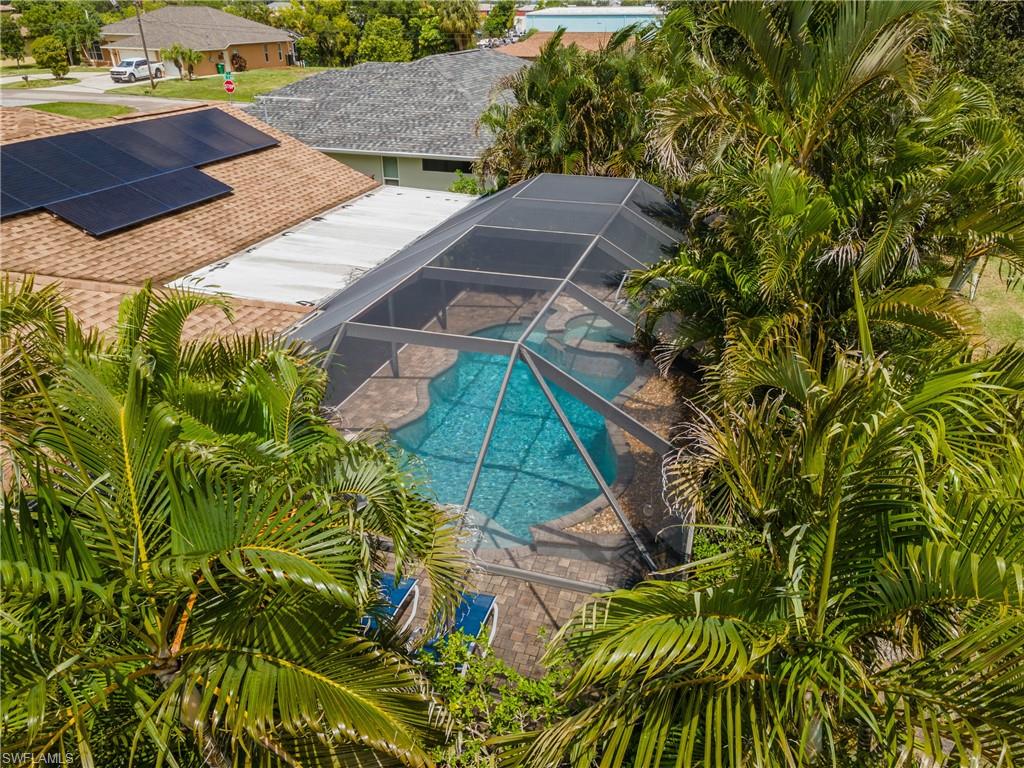 Screened pool area featuring paver decking