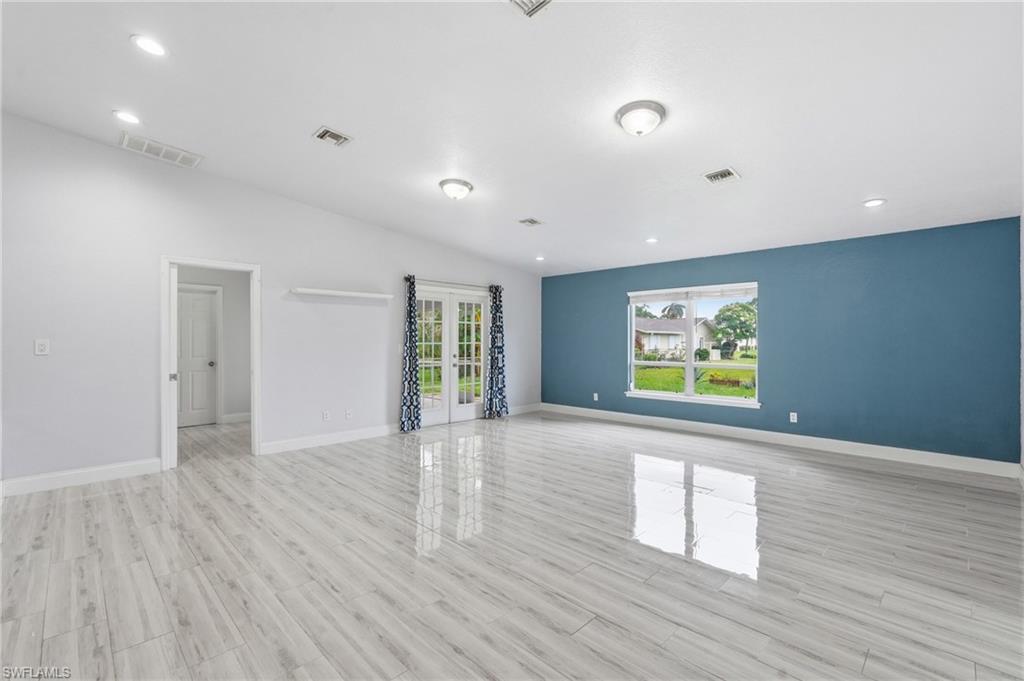 Spacious Living Room with Vaulted Ceiling allows endless possibilities in furnishing the room. Direct access to the Lani through the French Doors.