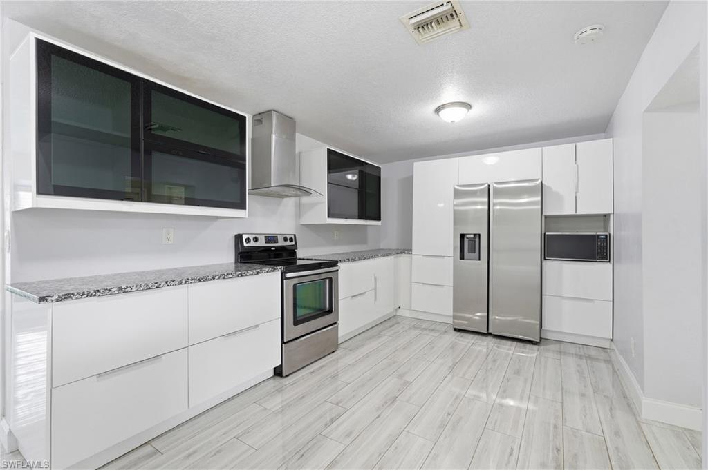 Pantry to the left of the refrigerator.