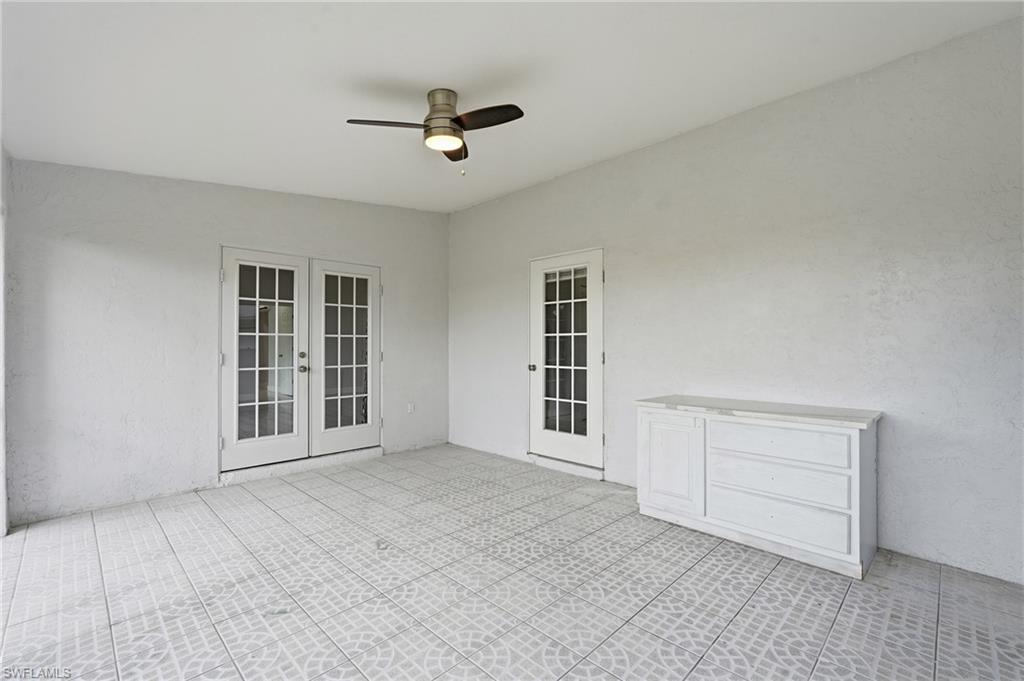 Covered Lanai.  French Doors enter Living Room, Single door enters hallway to 3rd Bath and Laundry room.  Also can access the kitchen and Living Room from the hallway.