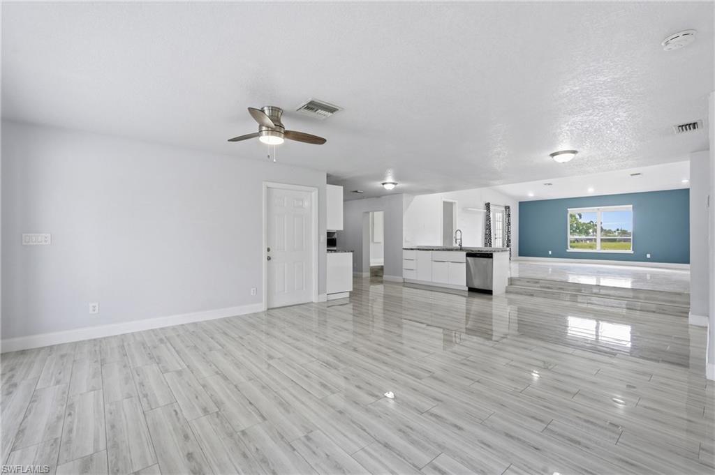 View from Front Entry.  Newer tile flooring throughout the entire home.