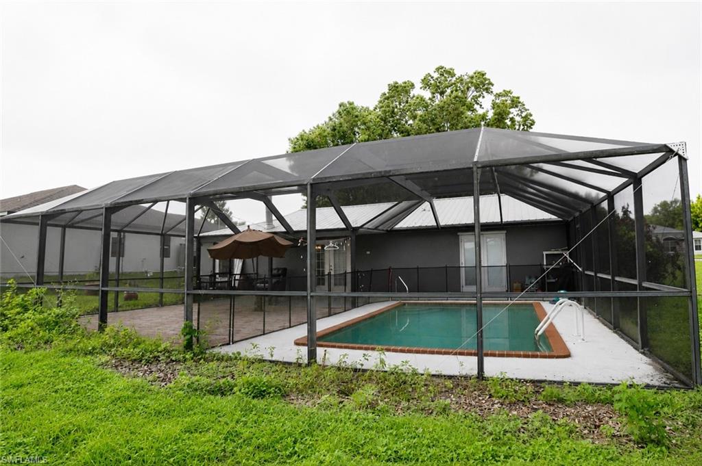 Side View of the Pool and Extended Paver Lanai.