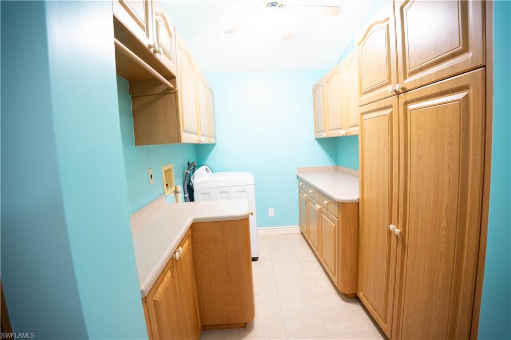 Laundry Room with Plenty of Cabinets.