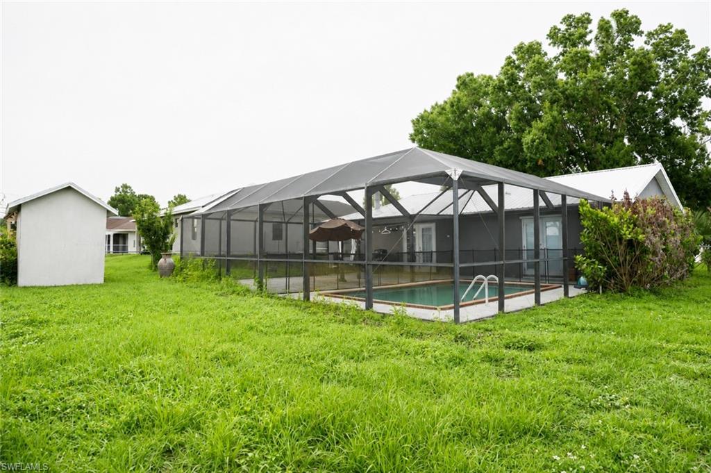 Back Yard View with Screened Pool and Extended Paver Lanai.