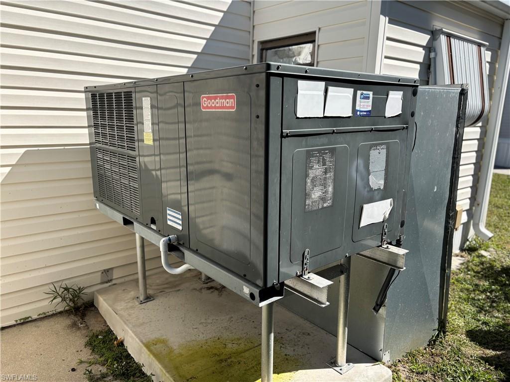 Exterior view of pet washing station and a central air condition unit