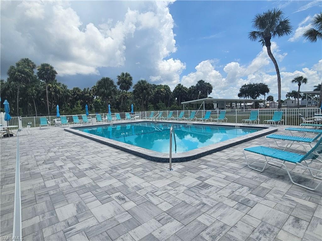Community pool featuring a patio area