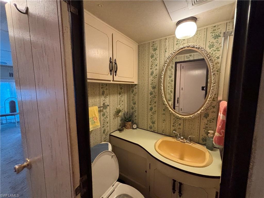 Vanity with integrated sink and upper cabinetry