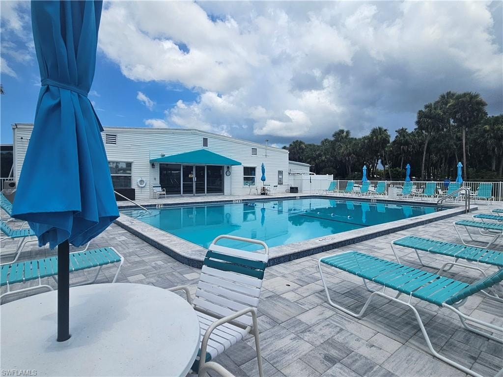 Community pool featuring a patio area
