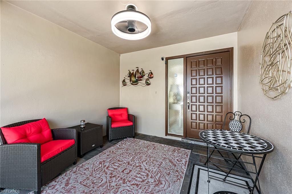 Enter through cozy sunroom