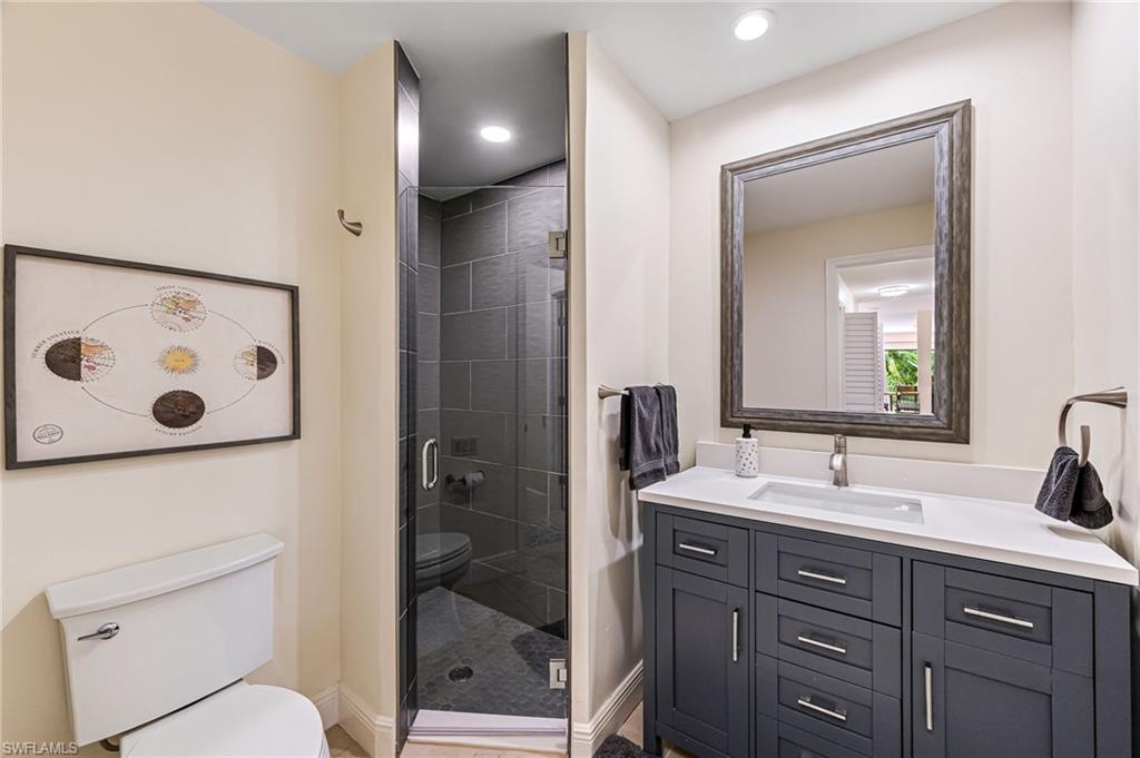 Guest bathroom,with vanity, a shower with shower and toilet