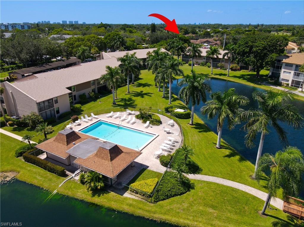 Community pool, poolside lounge area, recreational building, waterway access, and extensive green spaces
