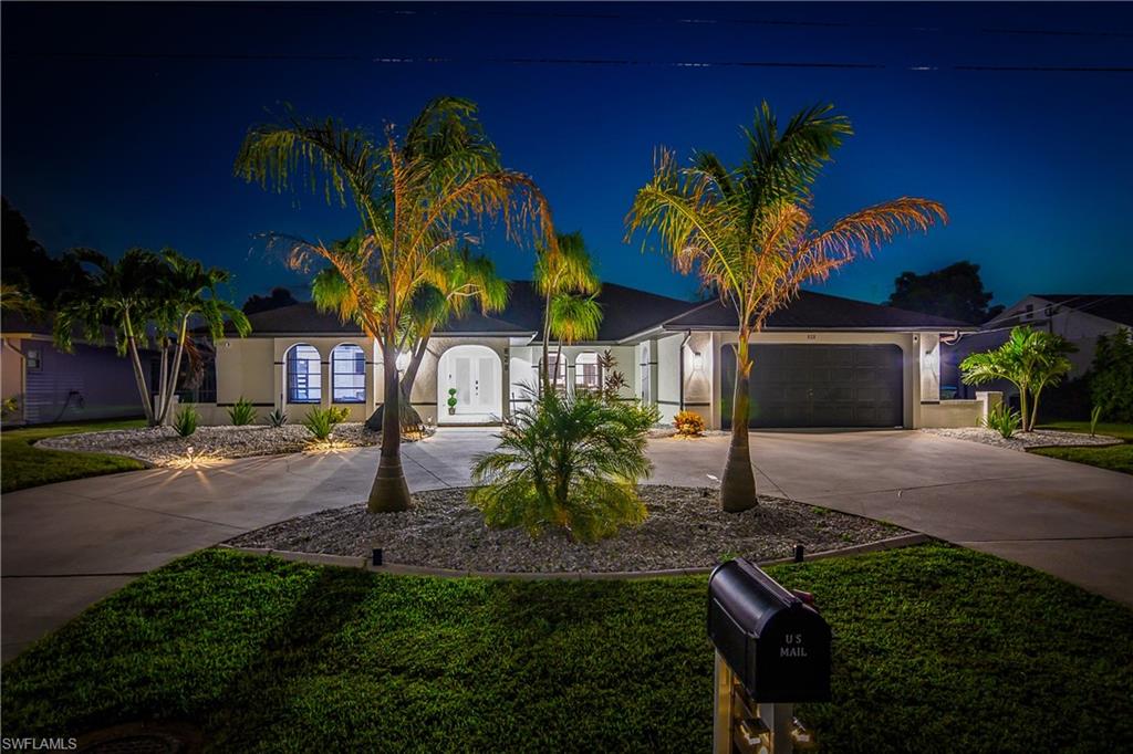 Contemporary single-story residence with a concrete driveway and an attached two-car garage