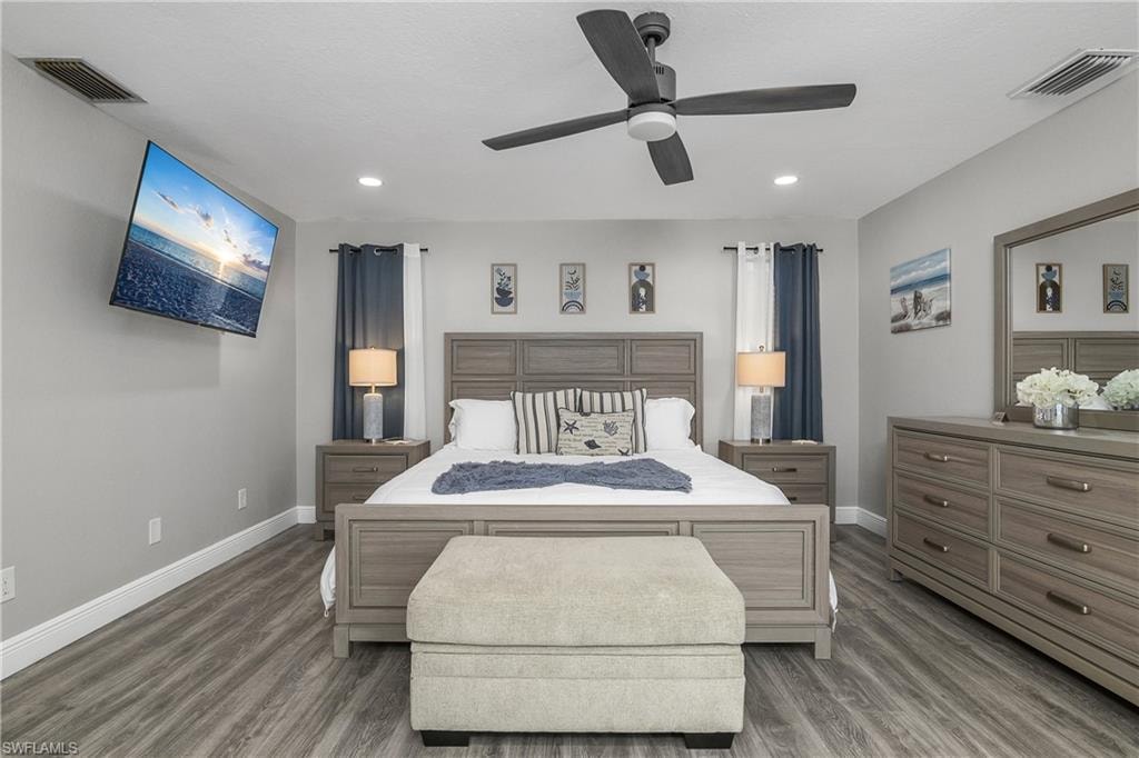 Spacious interior featuring wood-finish flooring, recessed lighting, and a ceiling fan