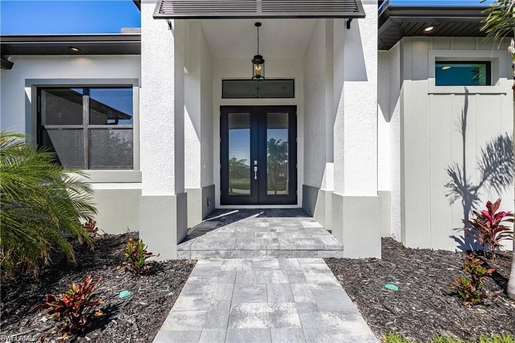 Entrance to property featuring french doors