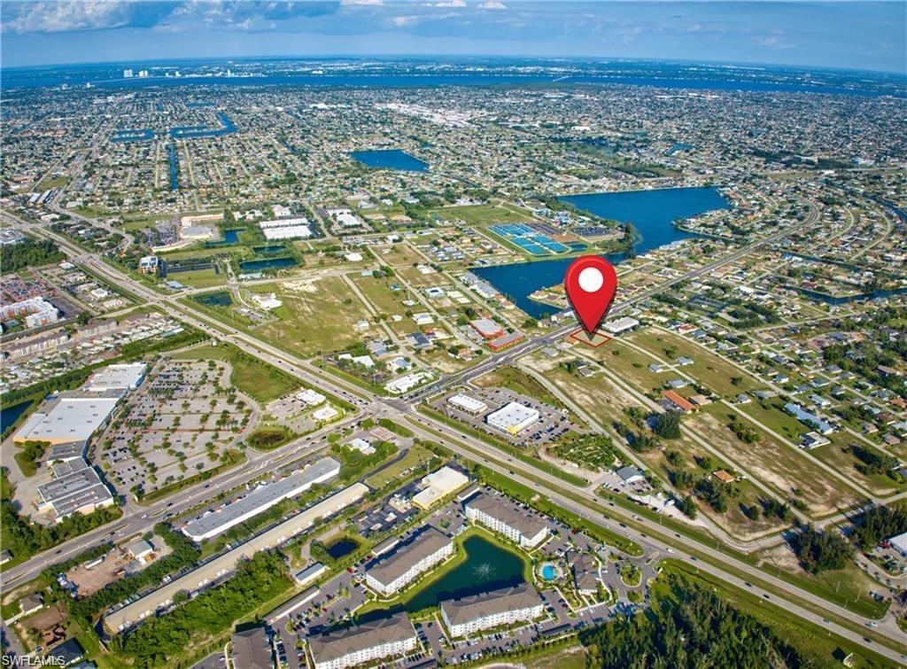 Aerial depiction of a developed urban area featuring a prominent waterway system