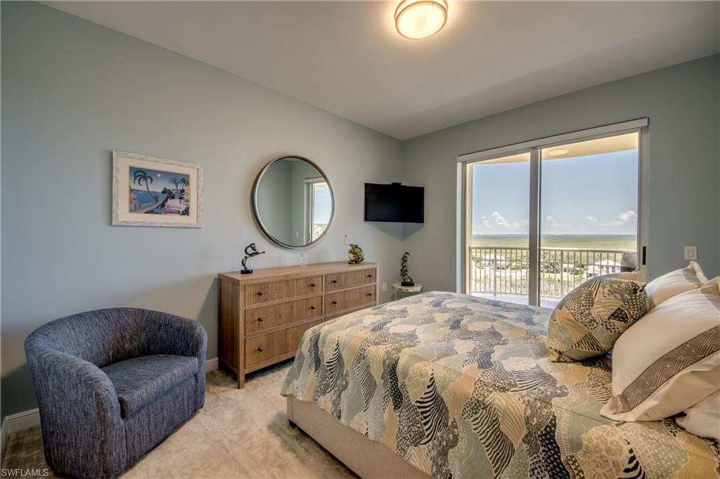 Guest bedRoom featuring light blue walls, a ceiling-mounted light fixture, and light-toned carpeting