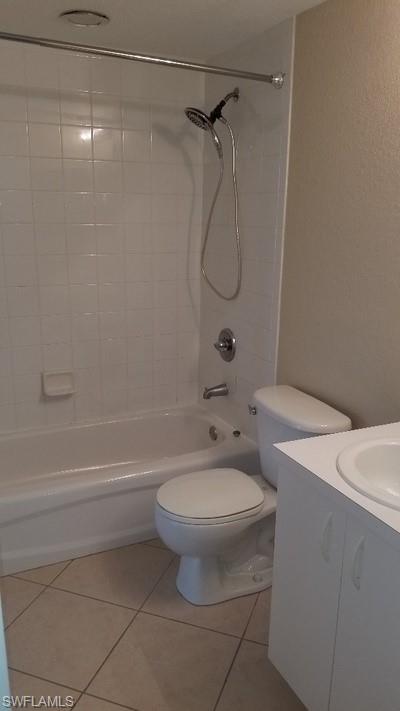White ceramic tile shower surround with a tub/shower combination