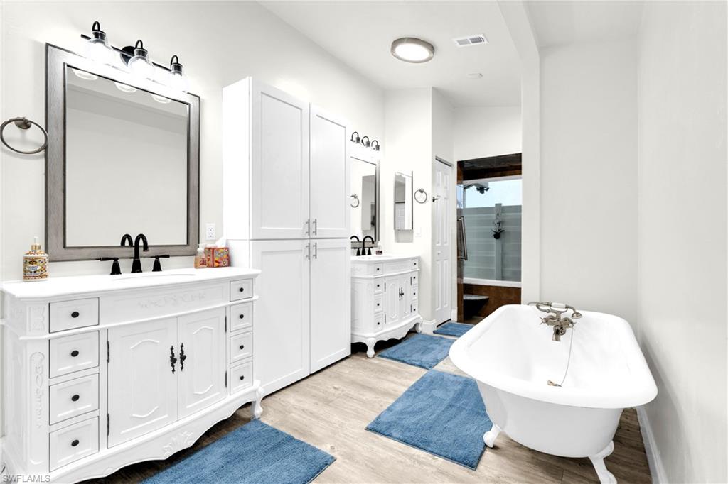 The Master Bathroom Has A Claw Footed Tub, Dual Sinks And Mirrors, Extra Storage, Bosch Instant Under The Sink Hot Water Heaters, And A Glass Enclosed Shower That Has A Great View Of The Outdoors!