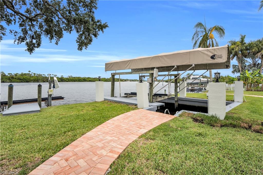 This Home Comes With A Covered Boat Lift And Slip!