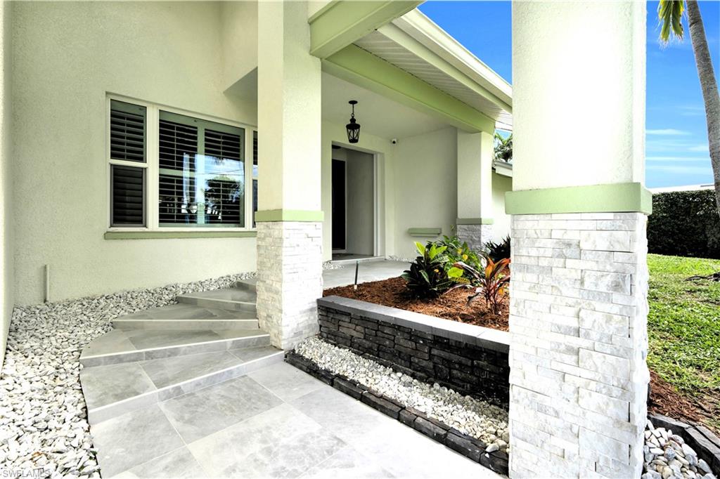 The Front Entry Was Recently Redone With New Entry Tile, Stone Covered Pillars, And New White Rock Was Added!