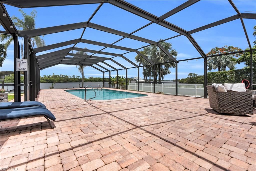 The Pool Area Come With A Paver Pool Deck And A Screened Lanai That Contains A Picture Window View At The End For A Maximum View Of The Amazing Caloosahatchee River!