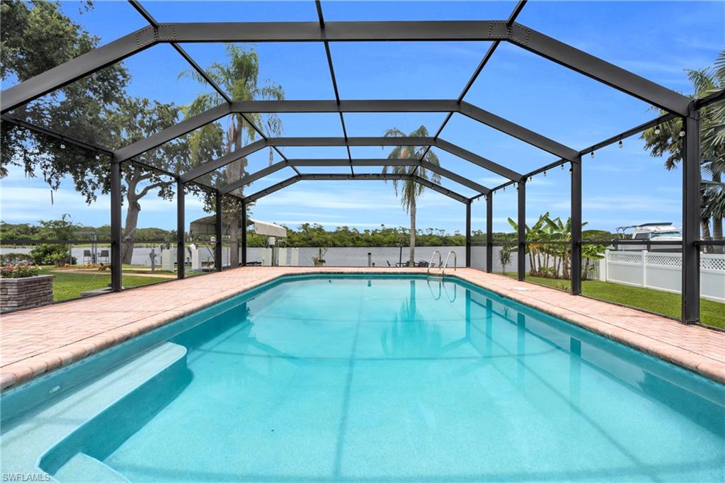 The Pool Area Come With A Paver Pool Deck And A Screened Lanai That Contains A Picture Window View At The End For A Maximum View Of The Amazing Caloosahatchee River!