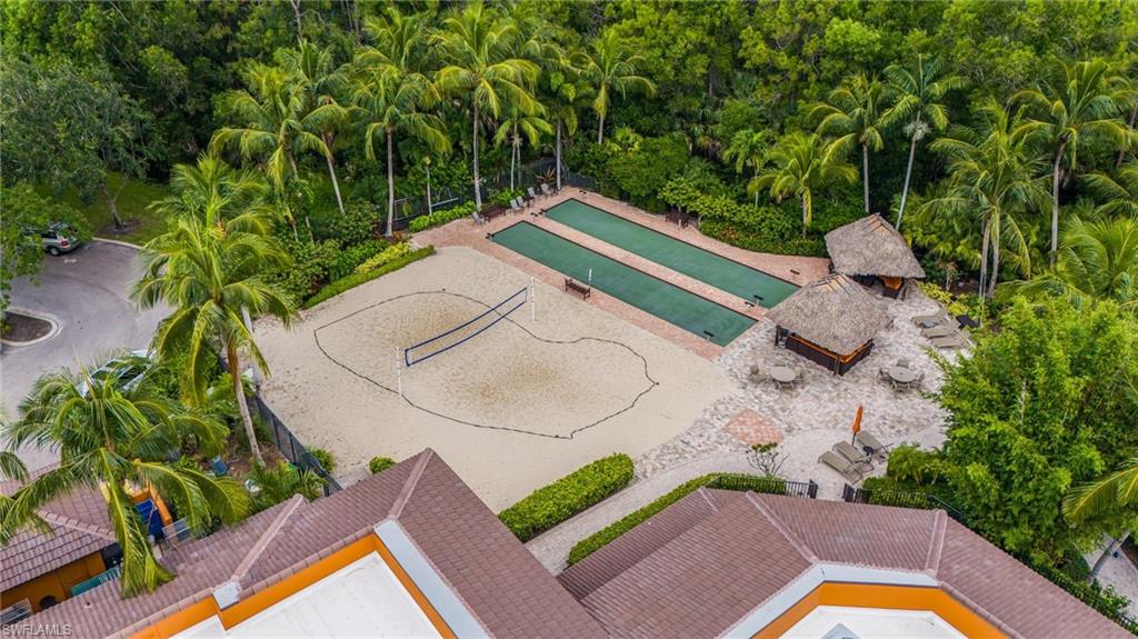 Aerial view highlighting community amenities surrounded by lush tropical landscaping