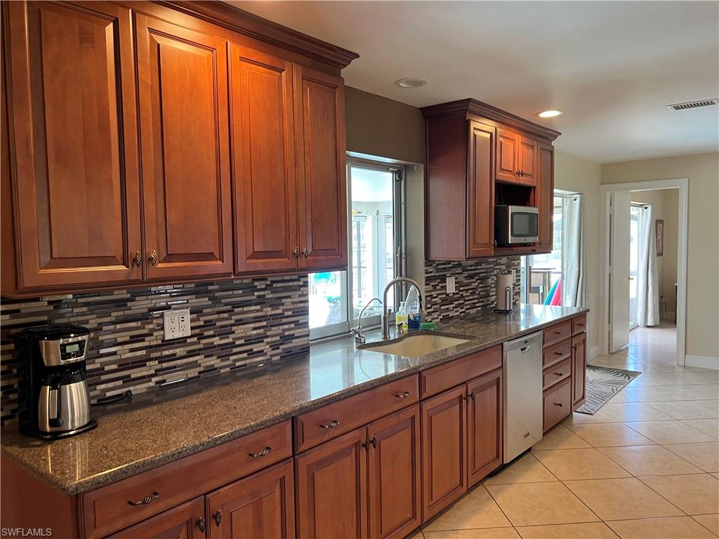 SOLID CHERRY CABINETS THRU-OUT THE HOME