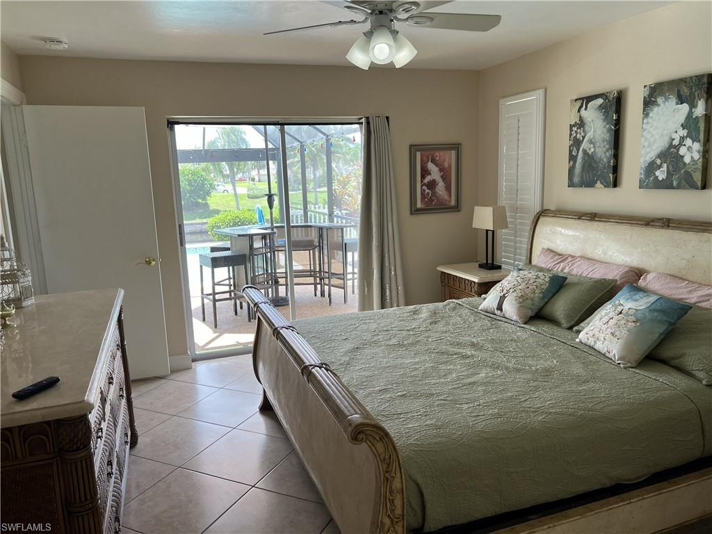MASTER BEDROOM HAS SLIDER TO THE POOL AND LANAI